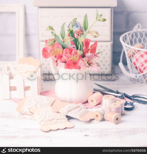 Vintage still life with handcraft materials and flowers. Vintage still life