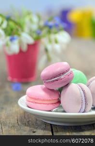 vintage still life with macaroons and spring flowers