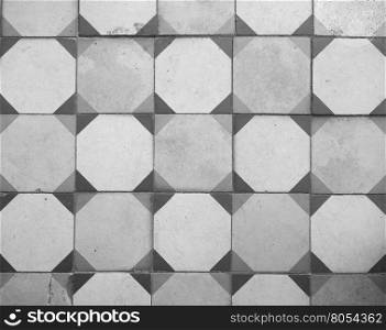 Vintage stone floor background in black and white. Vintage tiled stone floor useful as a background in black and white