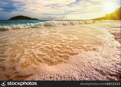 Vintage style beautiful landscape blue sky over the sea white waves on the beach during sunrise in summer at Koh Miang island, Mu Ko Similan National Park, Phang Nga province, Thailand