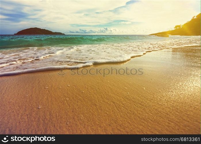 Vintage style beautiful landscape blue sky over the sea white waves on the beach during sunrise in summer at Koh Miang island, Mu Ko Similan National Park, Phang Nga province, Thailand