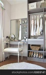 vintage style dressing room with classic white chair and dressing table