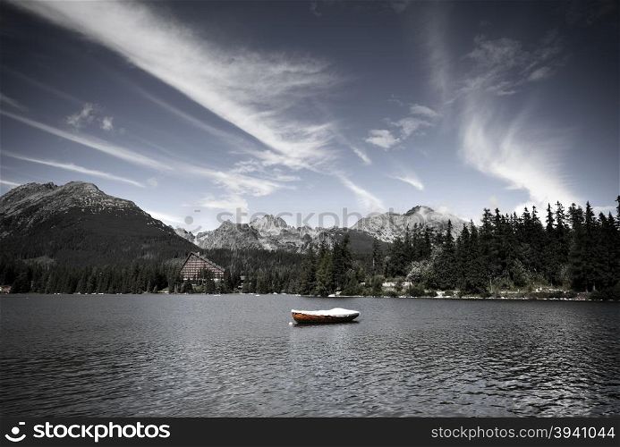 Vintage style image of alpine mountain lake