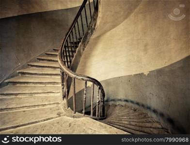 Vintage style image of old round spiral stairs