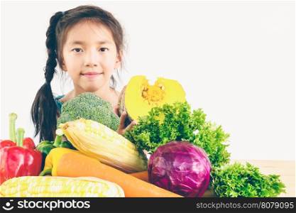 Vintage style photo of asian lovely girl showing enjoy expression with fresh colorful vegetables isolated over white background