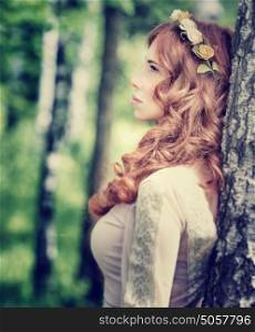 Vintage style photo of gentle woman in the park, side view of nymph with flower wreath on redhead, fashionable look concept