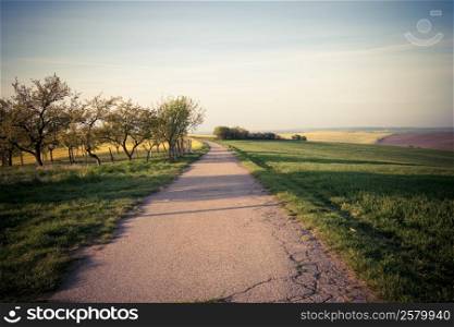 Vintage style photo of road at beautiful countryside view