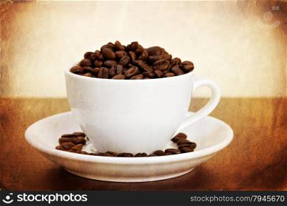 Vintage style photo of white cup of coffee beans