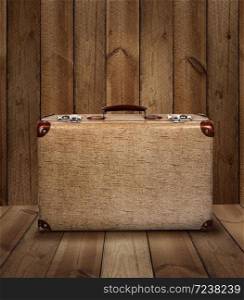 Vintage suitcase on rough wooden plank background