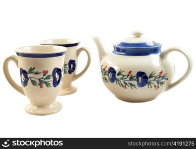 vintage tea pot and cups on white background