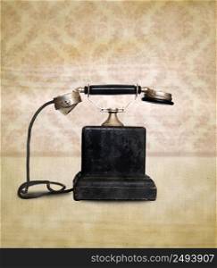 Vintage telephone on retro background