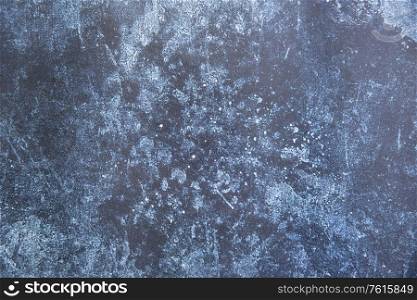 Vintage textured rough old background in blue with toned strokes