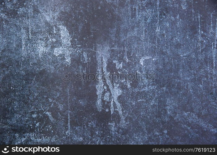 Vintage textured rough old background in blue with toned strokes