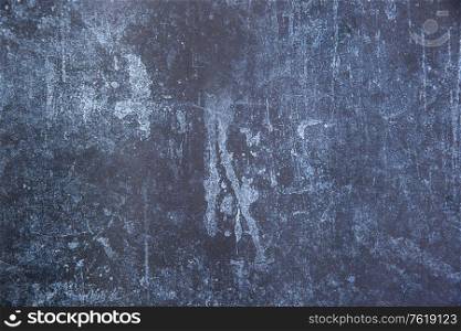 Vintage textured rough old background in blue with toned strokes