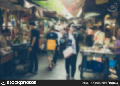 Vintage tone abstract image blur Market Festival on street. Make a background image of the product.