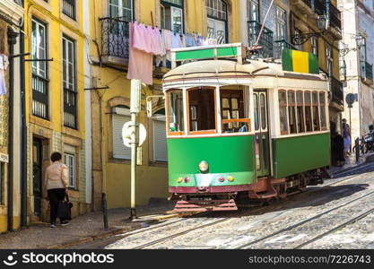 Vintage tram in the city center of Lisbon in a beautiful summer day, Portugal