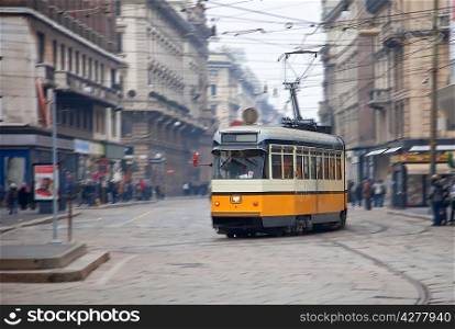 Vintage tram on the city street with motion blur, Milano, Italy