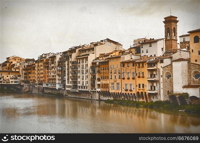 Vintage travel card. Old houses on the Arno River and Ponte Vecchio in Florence, Italy . Vintage travel card with Florence