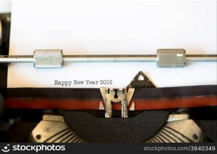 Vintage typewriter with a text that says happy new year 2016