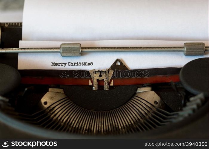 Vintage typewriter with a text that says merry Christmas
