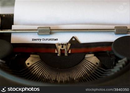 Vintage typewriter with a text that says merry Christmas