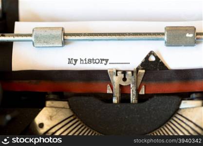 Vintage typewriter with a text that says my history