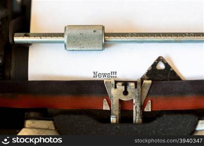 Vintage typewriter with a text that says news