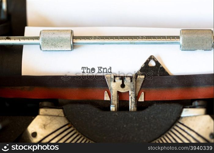 Vintage typewriter with a text that says the end