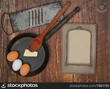 vintage utensils set, skillet,spoon,grater, eggs,butter, space for your text on a blank menu card