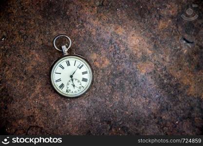 Vintage watch lies on a wood board, autumn time