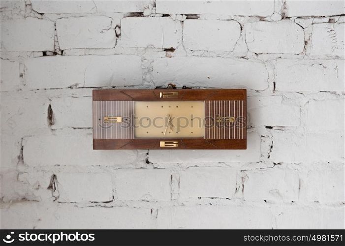 Vintage watches on white brick wall