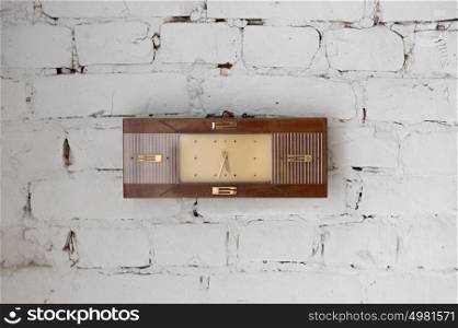 Vintage watches on white brick wall