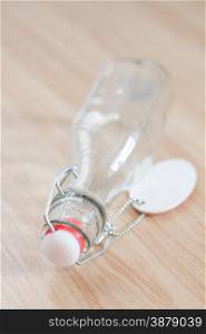 Vintage water bottle on wooden background, stock photo
