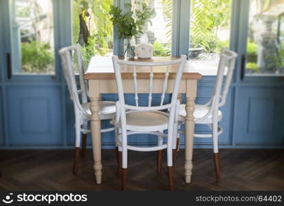 Vintage white wooden furniture beside the window, stock photo