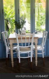Vintage white wooden furniture beside the window, stock photo