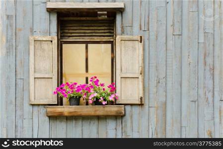 Vintage window on wooden wall