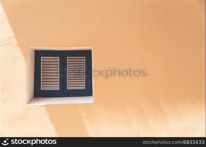 Vintage windows on the orange wall