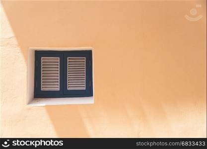 Vintage windows on the orange wall