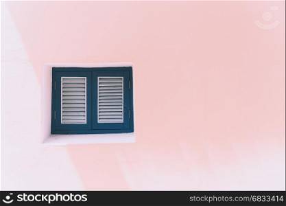 Vintage windows on the pink wall