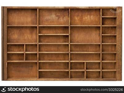 vintage wood printer (typesetter) drawer with numerous dividers, isolated on white