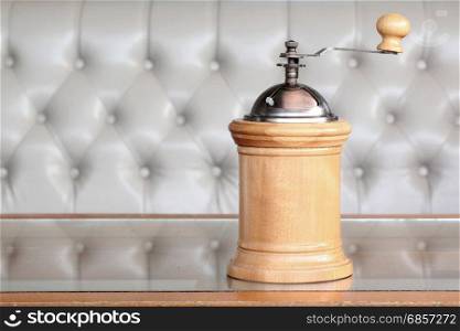 vintage wooden coffee grinder on the table