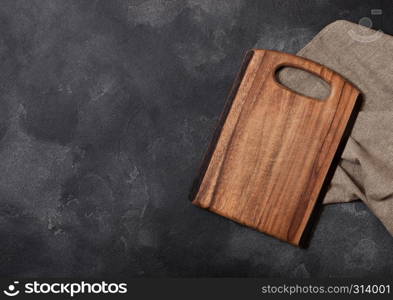 Vintage wooden cutting board with towel. Kitchen cooking concept. Space for text