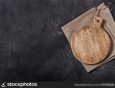 Vintage wooden cutting board with towel. Kitchen cooking concept. Space for text