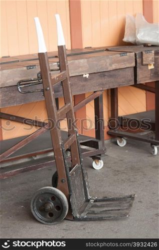 vintage wooden handcart on a railroad platform