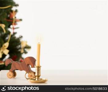 Vintage Wooden Horse on Santa's work table, Christmas Tree on background