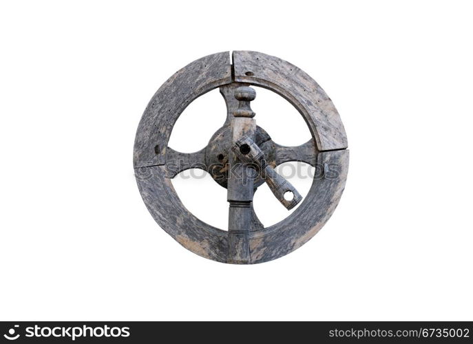 Vintage wooden spinning wheel against white background