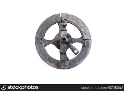 Vintage wooden spinning wheel against white background