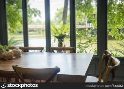 Vintage wooden table set beside the window, stock photo