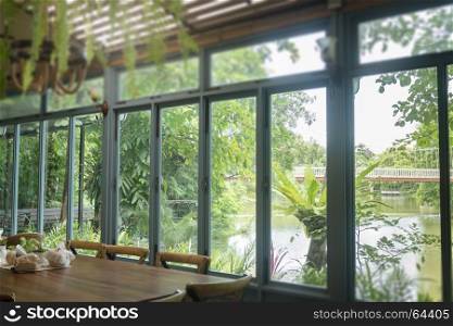 Vintage wooden table set beside the window, stock photo