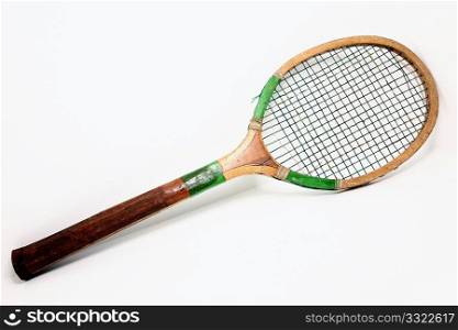 Vintage wooden tennis racket over white.